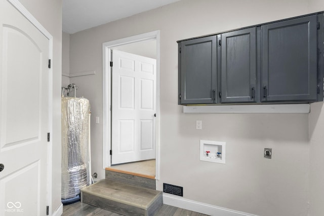 121 Hooton Blvd, Madison, IN 47250 - washroom with hookup for a washing machine, hookup for an electric dryer, cabinet space, and wood finished floors