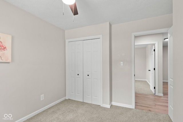 121 Hooton Blvd, Madison, IN 47250 - unfurnished bedroom with carpet flooring, a closet, and a ceiling fan