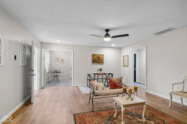121 Hooton Blvd, Madison, IN 47250 - living room featuring a textured ceiling, light wood-style flooring, a ceiling fan, and recessed lighting