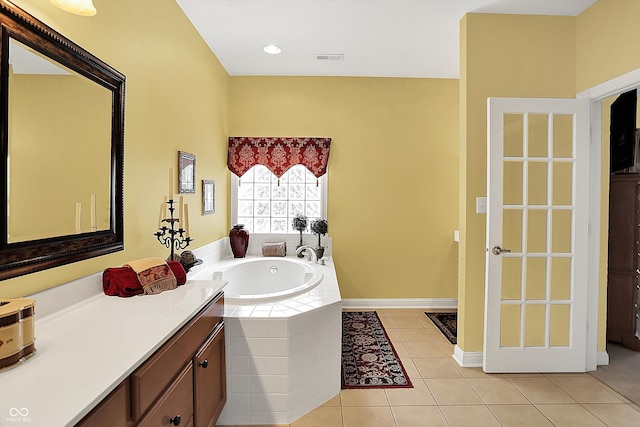 4704 Pearcrest Way, Greenwood, IN 46143 - bathroom with a garden tub, tile patterned floors, and vanity