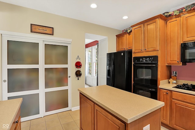 4704 Pearcrest Way, Greenwood, IN 46143 - kitchen featuring black appliances, a kitchen island, light countertops, recessed lighting, and light tile patterned flooring
