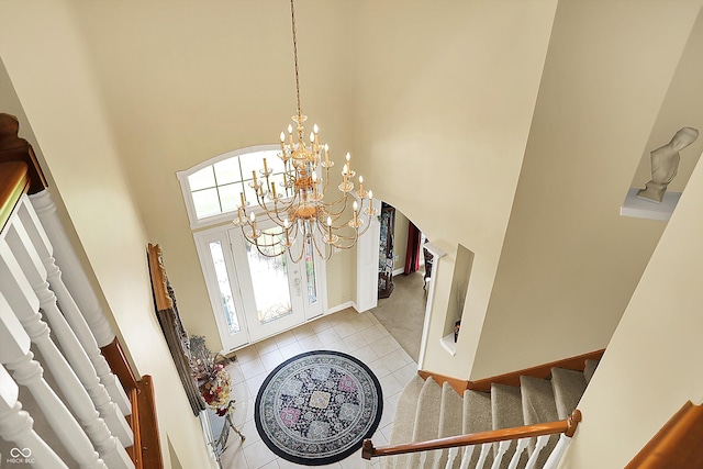 4704 Pearcrest Way, Greenwood, IN 46143 - foyer entrance featuring a towering ceiling, light tile patterned flooring, a chandelier, and stairway