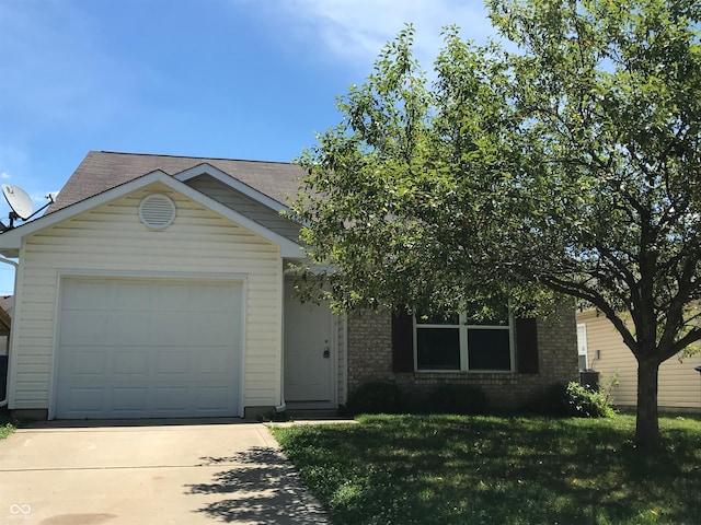 3929 Roundwood Dr, Indianapolis, IN 46235 - view of front facade featuring concrete driveway, brick siding, a front lawn, and an attached garage