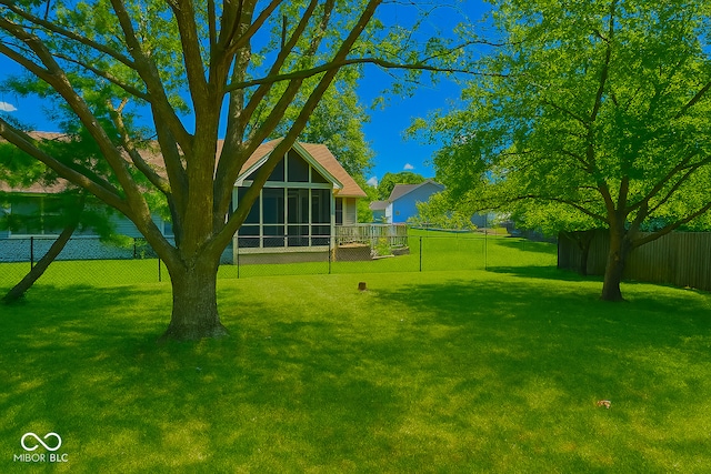 3363 Paddington Dr, Columbus, IN 47203 - fenced backyard featuring a sunroom