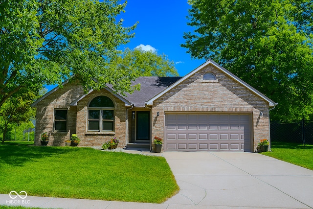 3363 Paddington Dr, Columbus, IN 47203 - ranch-style home with driveway, an attached garage, and brick siding
