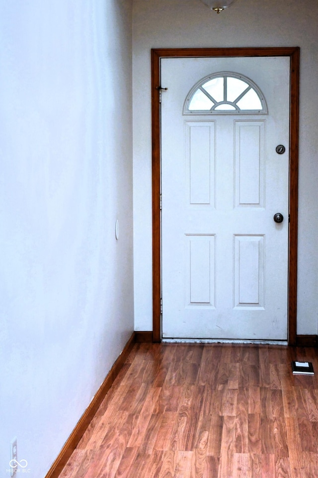 3363 Paddington Dr, Columbus, IN 47203 - foyer featuring baseboards and dark wood finished floors