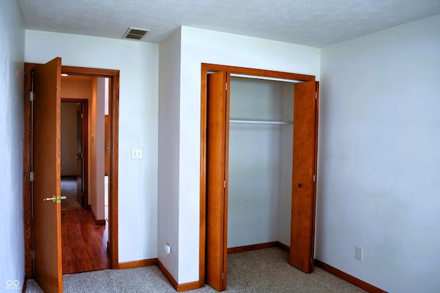 3363 Paddington Dr, Columbus, IN 47203 - unfurnished bedroom with a closet and light carpet