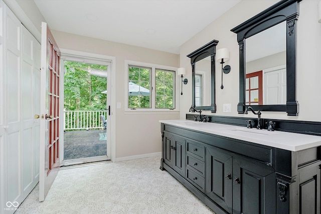 6280 N Chester Ave, Indianapolis, IN 46220 - full bathroom featuring baseboards and double vanity