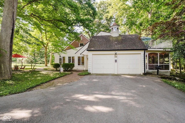 6280 N Chester Ave, Indianapolis, IN 46220 - view of front of home featuring driveway, a garage, and roof with shingles