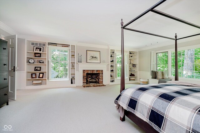 6280 N Chester Ave, Indianapolis, IN 46220 - carpeted bedroom with crown molding and a brick fireplace