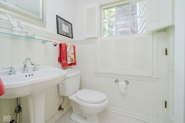6280 N Chester Ave, Indianapolis, IN 46220 - half bath featuring tile patterned floors and a wainscoted wall