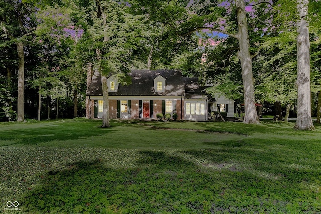 6280 N Chester Ave, Indianapolis, IN 46220 - new england style home with a front lawn and brick siding