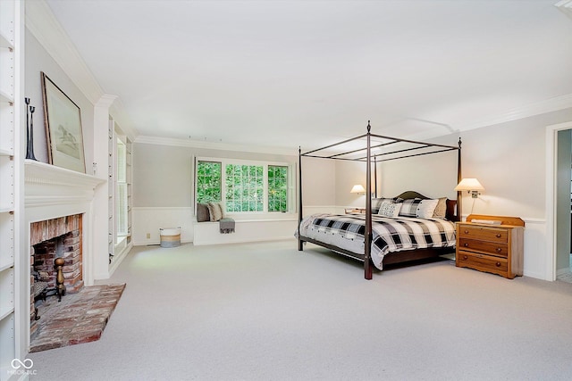6280 N Chester Ave, Indianapolis, IN 46220 - carpeted bedroom with crown molding and a brick fireplace