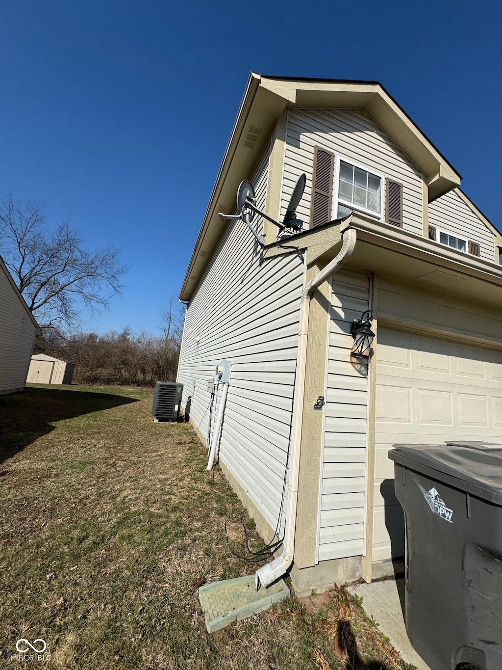 4408 Vestry Pl, Indianapolis, IN 46237 - view of home's exterior featuring a cooling unit and a garage