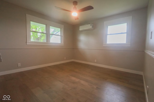 7300 N Banta Rd, Bargersville, IN 46106 - empty room featuring a wall mounted air conditioner, healthy amount of natural light, wood finished floors, and a ceiling fan