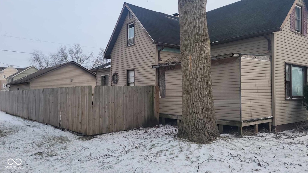 1508 N Morrison St, Kokomo, IN 46901 - snow covered property with a chimney and a shingled roof
