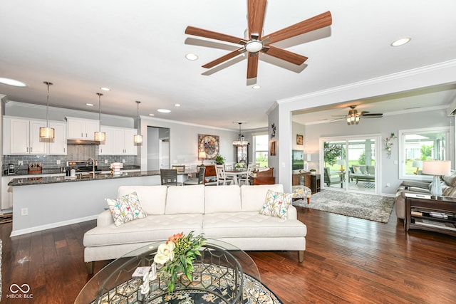 13427 Merryvale St, Fishers, IN 46037 - living area with ceiling fan, crown molding, recessed lighting, and dark wood-style flooring