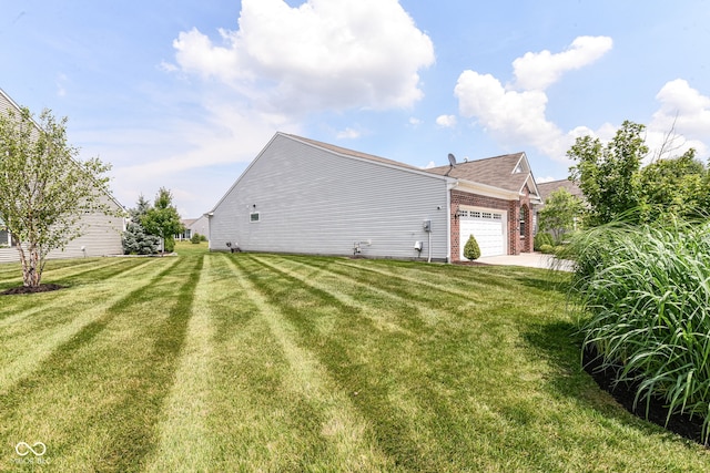 13427 Merryvale St, Fishers, IN 46037 - rear view of property with an attached garage, brick siding, and a yard