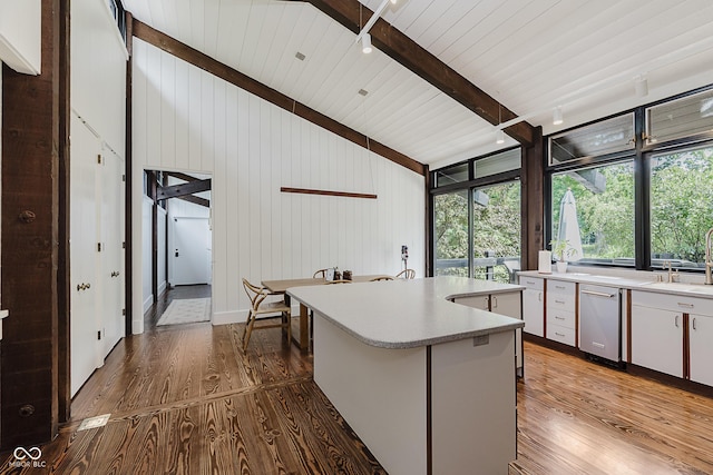 1616 W 116th St, Carmel, IN 46032 - kitchen featuring wood finished floors, light countertops, white cabinetry, a kitchen island, and floor to ceiling windows