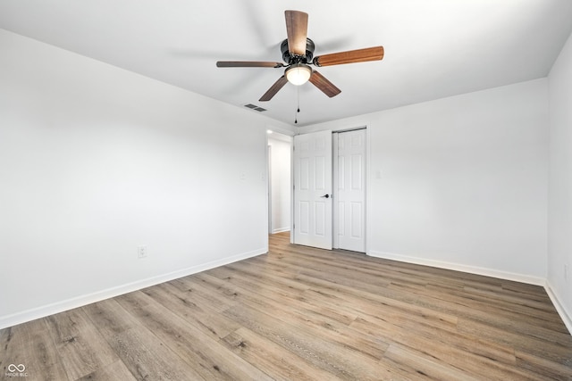 1011 Robin Dr, Anderson, IN 46013 - unfurnished bedroom featuring wood finished floors, a closet, and ceiling fan