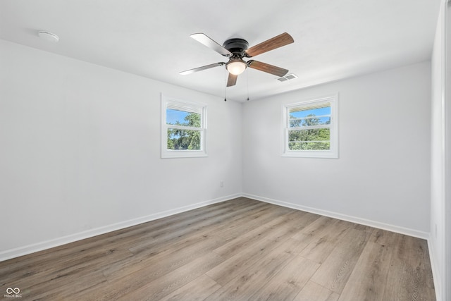 1011 Robin Dr, Anderson, IN 46013 - unfurnished room featuring light wood-style floors and a ceiling fan