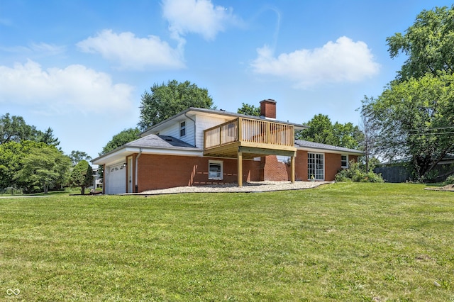 1011 Robin Dr, Anderson, IN 46013 - rear view of house featuring a chimney, an attached garage, and brick siding