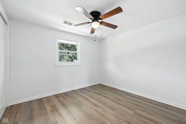 1011 Robin Dr, Anderson, IN 46013 - spare room with wood finished floors and ceiling fan