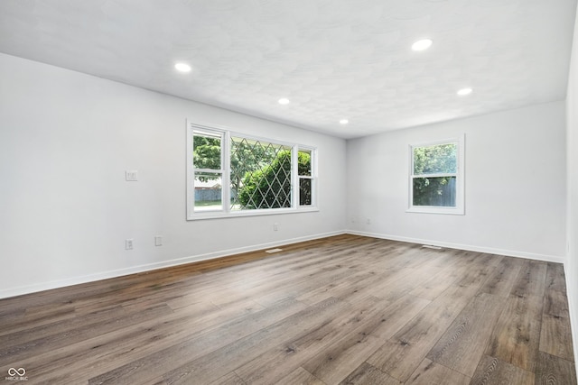 1011 Robin Dr, Anderson, IN 46013 - empty room featuring wood finished floors and recessed lighting