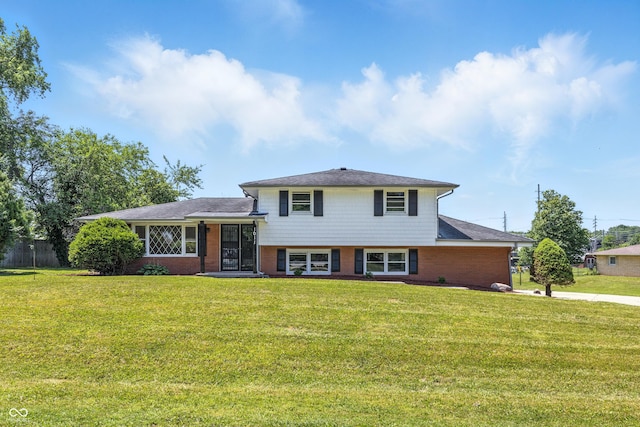 1011 Robin Dr, Anderson, IN 46013 - split level home featuring a front lawn and brick siding