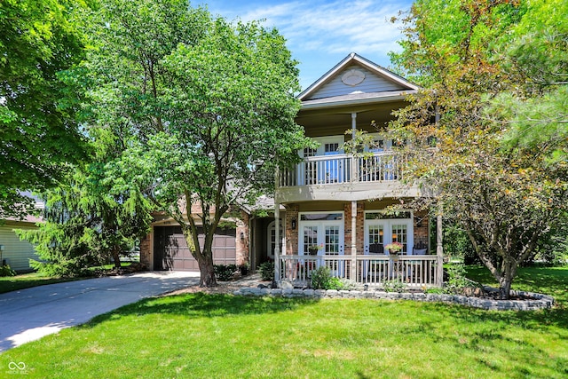 6298 Briargate Dr, Zionsville, IN 46077 - view of front of property with a front yard, concrete driveway, a balcony, and a porch
