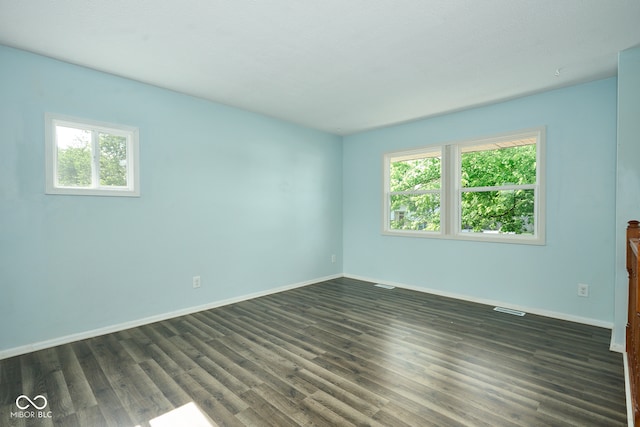 2606 Shakespeare Dr, Southport, IN 46227 - unfurnished room featuring healthy amount of natural light and dark wood-style floors