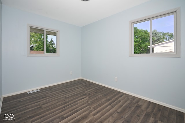 2606 Shakespeare Dr, Southport, IN 46227 - empty room with baseboards and dark wood-style floors