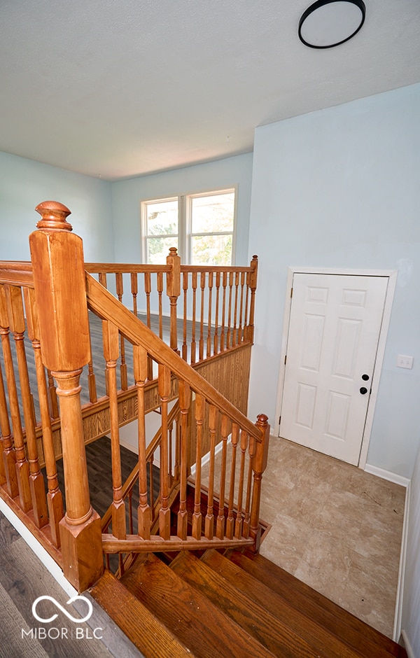 2606 Shakespeare Dr, Southport, IN 46227 - stairs with baseboards