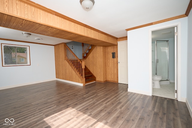2606 Shakespeare Dr, Southport, IN 46227 - below grade area featuring dark wood-style flooring, stairway, and crown molding