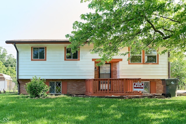 2606 Shakespeare Dr, Southport, IN 46227 - back of property featuring a yard and brick siding