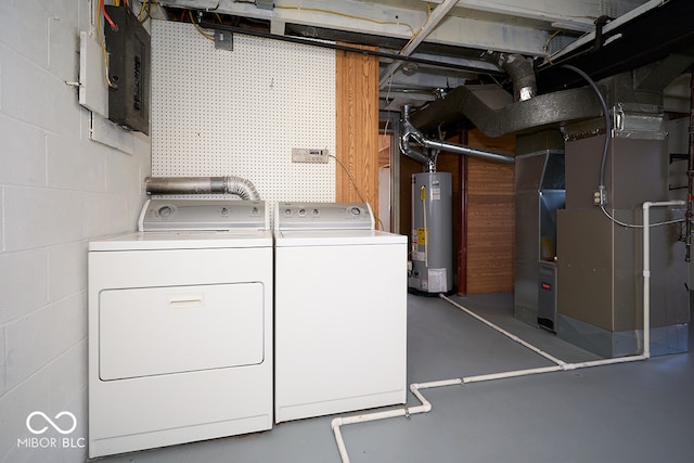 2606 Shakespeare Dr, Southport, IN 46227 - laundry area featuring water heater, independent washer and dryer, heating unit, concrete block wall, and electric panel
