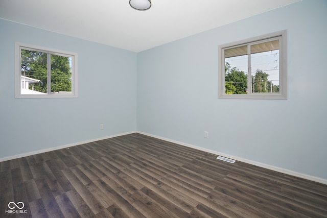 2606 Shakespeare Dr, Southport, IN 46227 - unfurnished room with healthy amount of natural light and dark wood finished floors