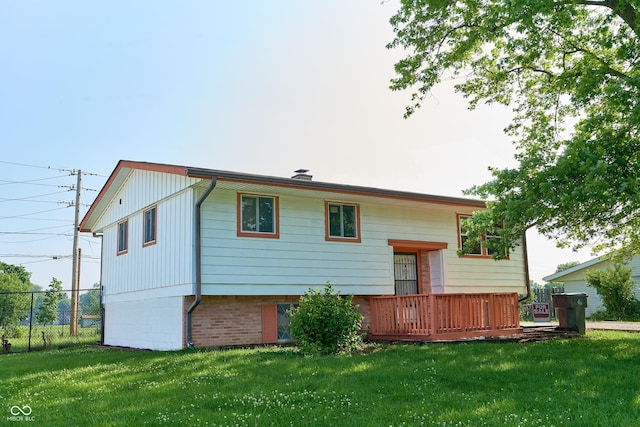 2606 Shakespeare Dr, Southport, IN 46227 - back of property featuring a wooden deck and brick siding