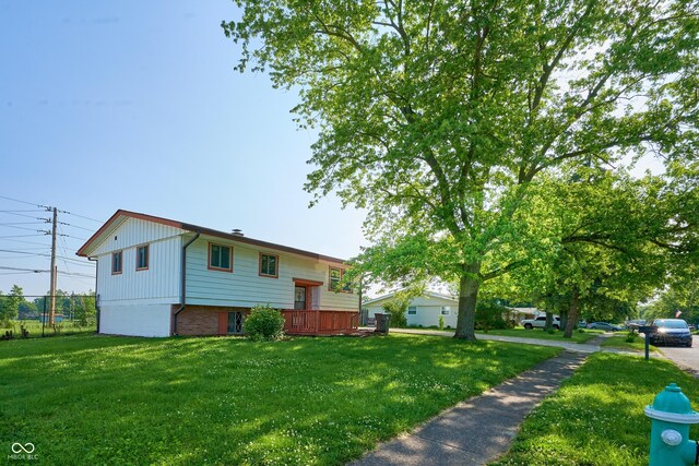 2606 Shakespeare Dr, Southport, IN 46227 - view of side of property with a deck and brick siding