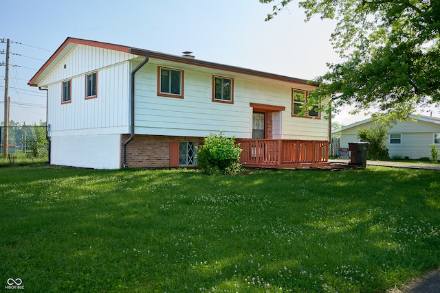 2606 Shakespeare Dr, Southport, IN 46227 - rear view of property with a deck and board and batten siding