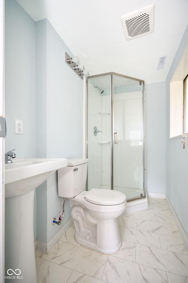 2606 Shakespeare Dr, Southport, IN 46227 - bathroom with marble finish flooring and a stall shower