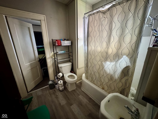 205 N Jackson St, Greencastle, IN 46135 - bathroom featuring wood finished floors and shower / bath combination with curtain