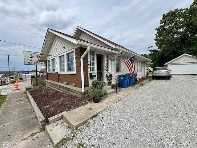 205 N Jackson St, Greencastle, IN 46135 - view of front of house with brick siding and an outbuilding