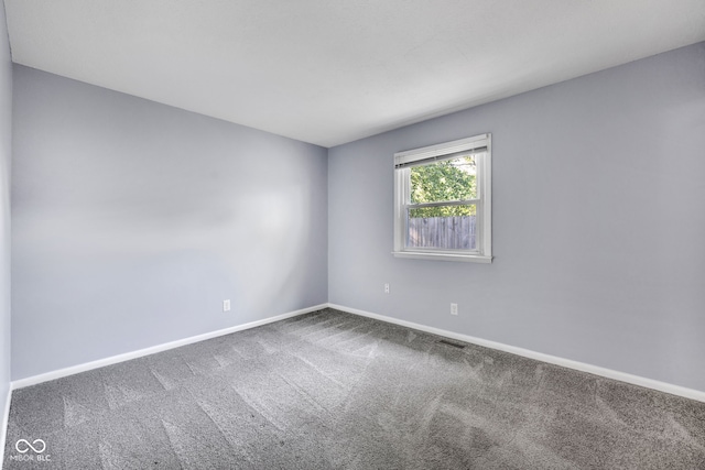 1231 N Graham Ave, Indianapolis, IN 46219 - spare room with carpet and baseboards