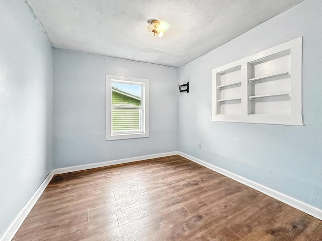 356 S 7th St, Frankfort, IN 46041 - empty room featuring wood finished floors and built in features