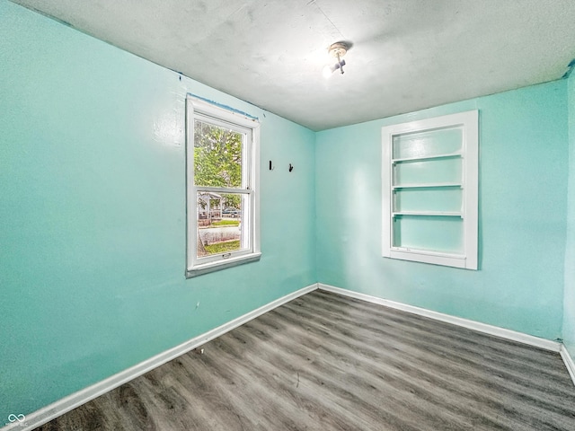 356 S 7th St, Frankfort, IN 46041 - empty room with wood finished floors and built in shelves