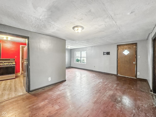 356 S 7th St, Frankfort, IN 46041 - spare room with wood finished floors and a textured ceiling