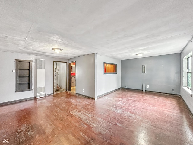 356 S 7th St, Frankfort, IN 46041 - unfurnished room with a heating unit and wood finished floors