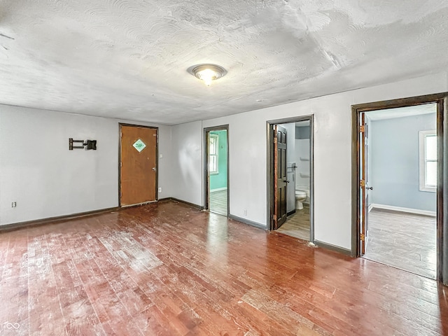 356 S 7th St, Frankfort, IN 46041 - empty room featuring wood finished floors and a textured ceiling