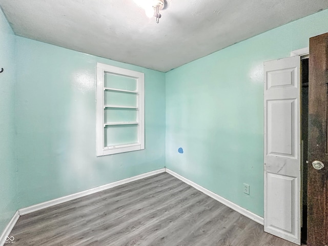 356 S 7th St, Frankfort, IN 46041 - unfurnished room with wood finished floors and built in features